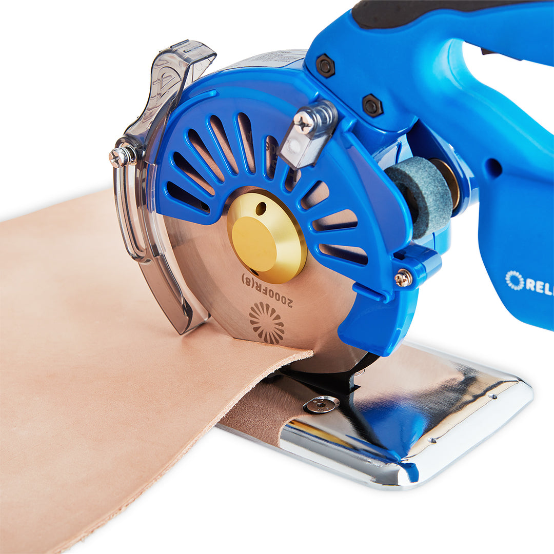 2000FR Cordless Cloth Cutting Machine in use on leather