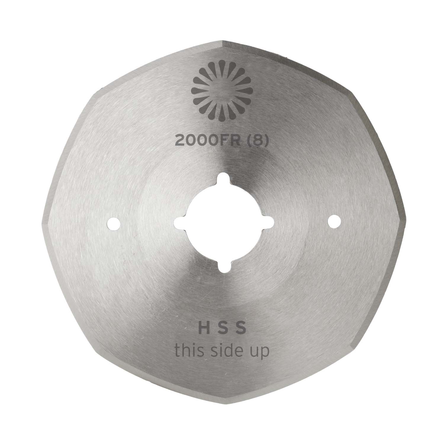 A hexagonal, silver 110 mm stainless steel blade for the Reliable 2000FR cordless cloth cutter, featuring a central hole, “HSS” and “this side up” markings, and an engraved sunburst logo near the top.